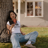 Shop Bibliophile x Subtle Dust: The Buy Me Books Ruffle Trim Baby Tee in White