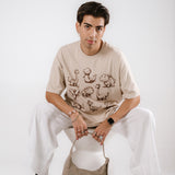 The AI Dino Oversized Tee in Sand
