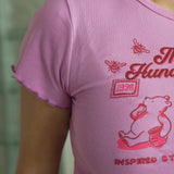 The Hundred Acre Wood Ruffle Trim Baby Tee in Pink