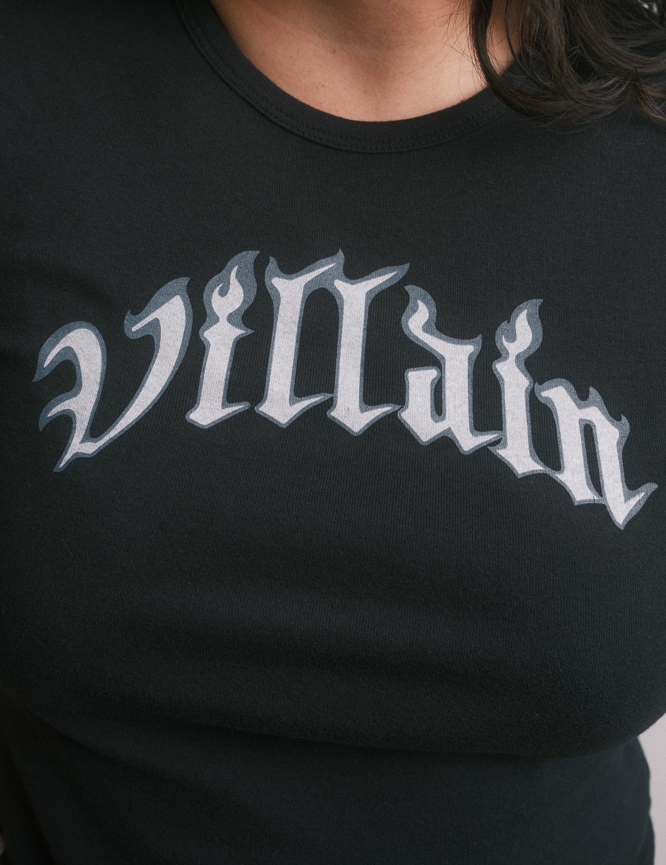 The Villain Baby Tee in Black