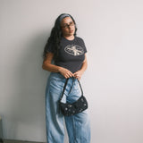 The Churro Bear Ruffle Trim Baby Tee in Vintage Black