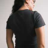 The Churro Bear Ruffle Trim Baby Tee in Vintage Black