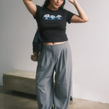 The Small World Baby Tee in Black