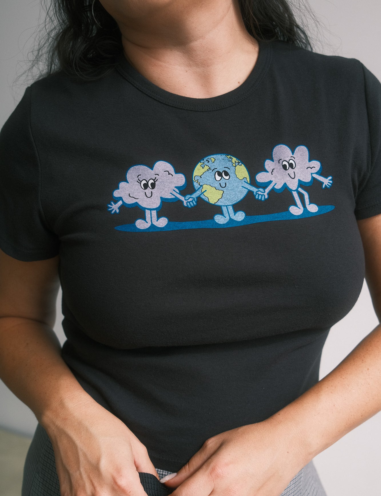 The Small World Baby Tee in Black