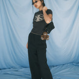 The Churro Bear Ruffle Trim Baby Tee in Vintage Black