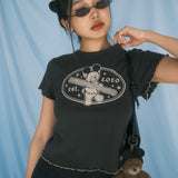 The Churro Bear Ruffle Trim Baby Tee in Vintage Black