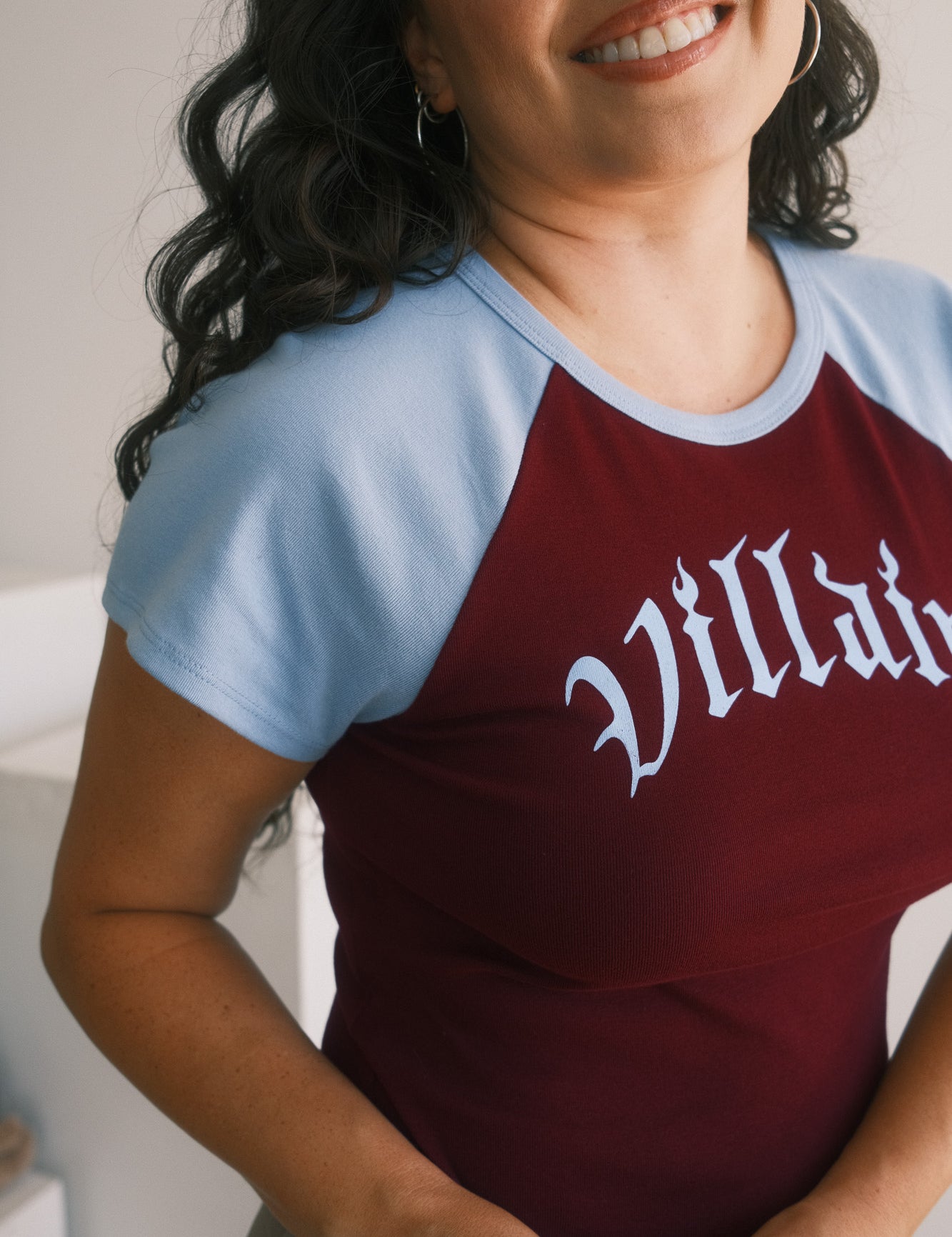 The Villain Raglan Baby Tee